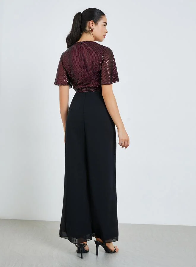 Styli  Women Burgundy Sequin Wrap Front Jumpsuit for Women | Best Price UAE